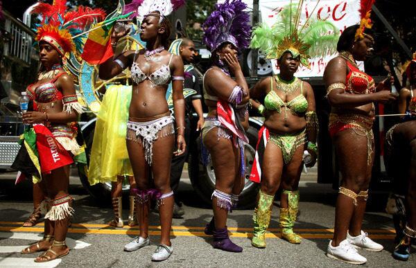 People look on before the start of the West Indian-American Day Parade in the Brooklyn borough of New York City.