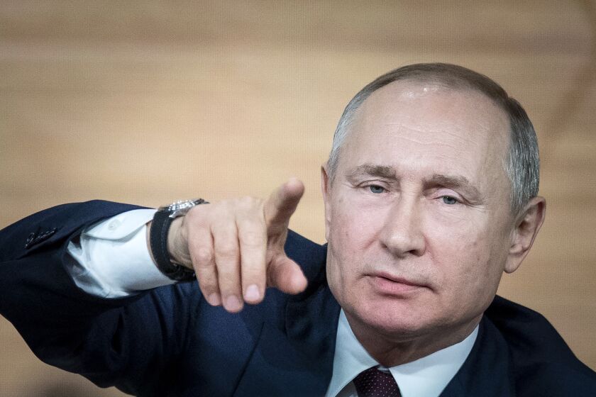 Russian President Vladimir Putin gestures during his annual news conference in Moscow, Russia, on Thursday.