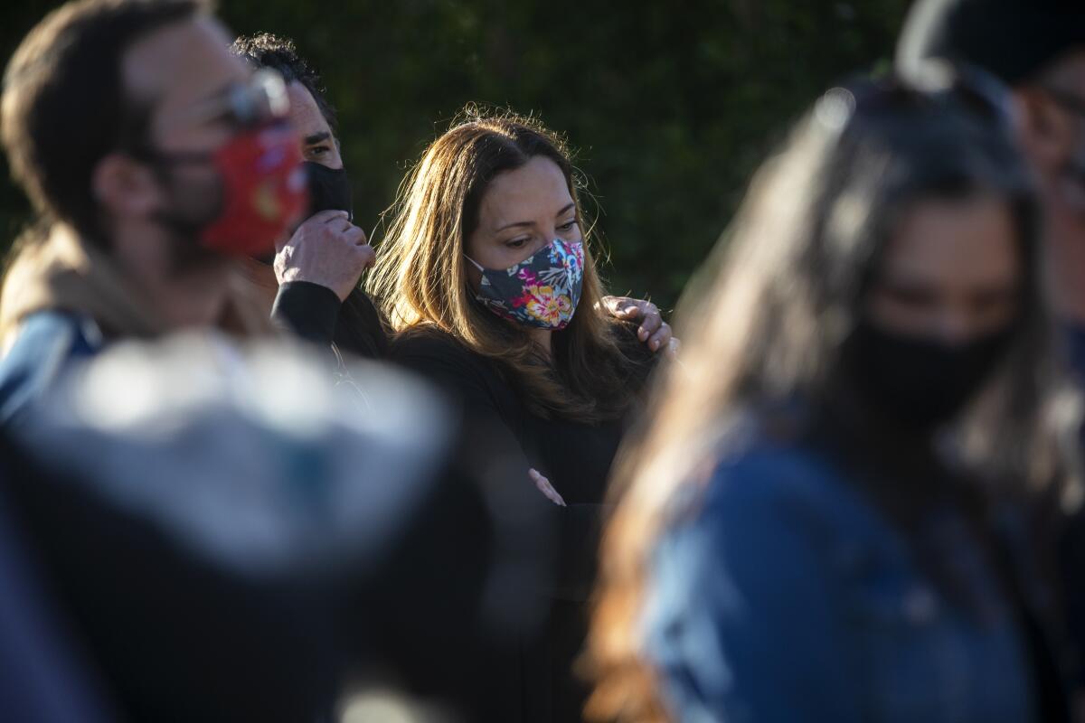 People in masks outside