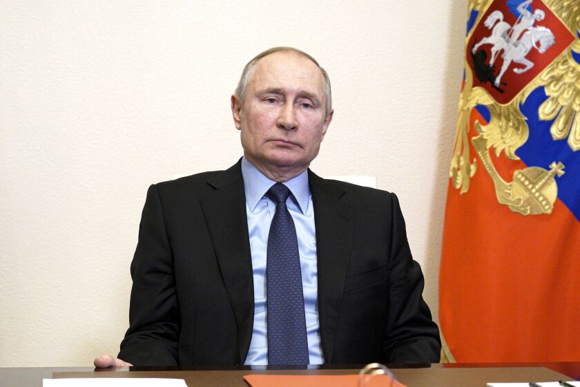 Russian President Vladimir Putin chairs a Security Council meeting via video conference at the Novo-Ogaryovo residence outside Moscow, Russia, Friday, March 12, 2021. (Alexei Druzhinin, Sputnik, Kremlin Pool Photo via AP)