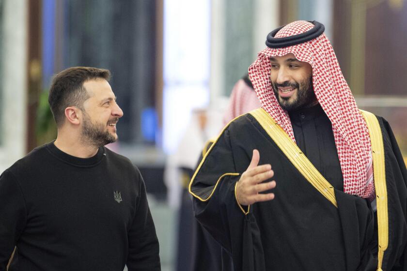 This handout image from the state-run Saudi Press Agency shows Ukrainian President Volodymyr Zelenskyy, left, meeting with Saudi Crown Prince Mohammed bin Salman in Riyadh, Saudi Arabia, Tuesday, Feb. 27, 2024. Zelenskyy arrived in Saudi Arabia on Tuesday and met the kingdom's powerful crown prince to push for a peace plan and the return of prisoners of war from Russia. (Saudi Press Agency via AP)