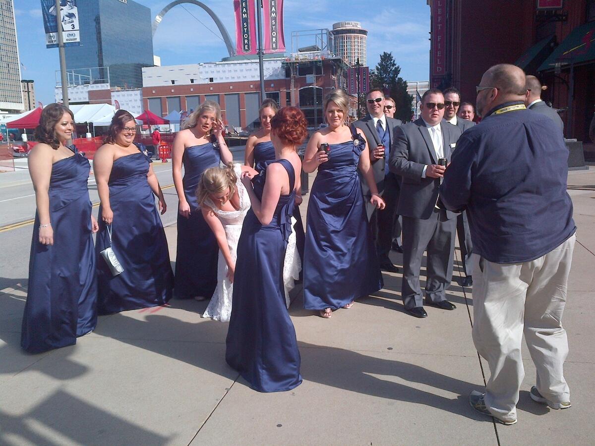 Chris Demko and Nikki Laurent stop by Busch Stadium with their wedding party before their nuptials.