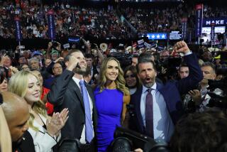 MILWAUKEE, WISCONSIN JULY 15, 2024 - (left to right) Tiffany Trump (white jacket), Eric Trump, Lara Trump (blue dress) and Donald Trump Jr., smile as they watch the roll call of states during the first day of the Republican National Convention, Monday, July 15, 2024, in Milwaukee. (Robert Gauthier / Los Angeles Times)