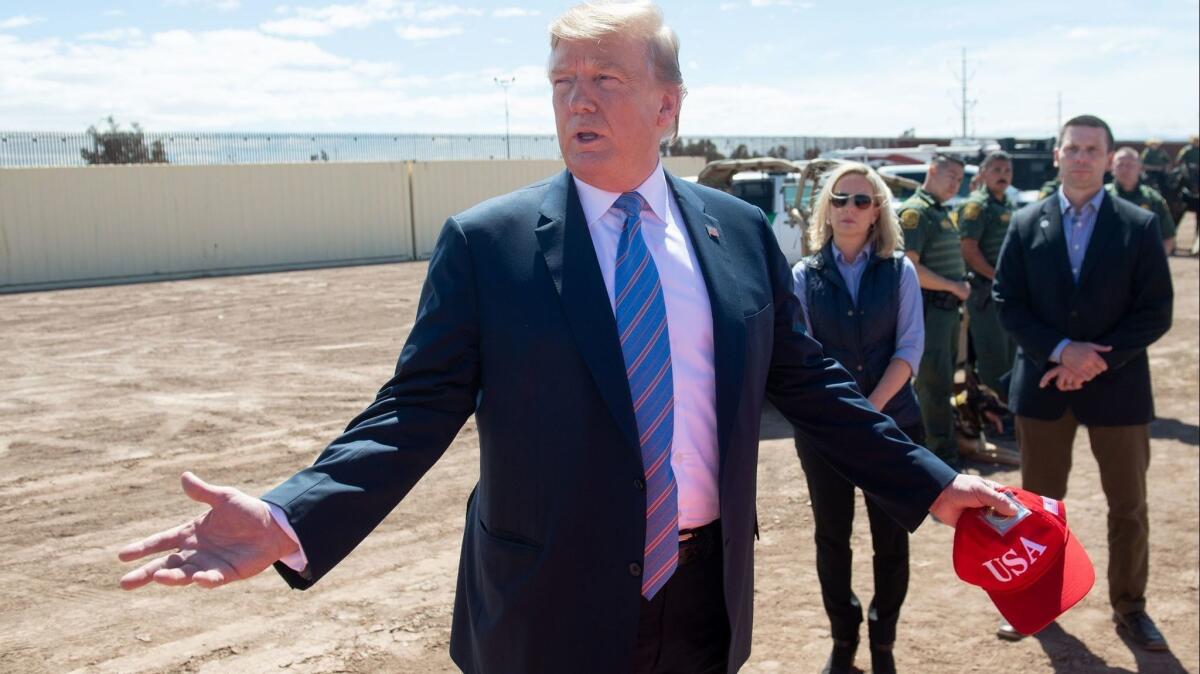 President Trump makes an appearance last month at the border in Calexico, Calif. His proposed border wall is the subject of one of the 50 lawsuits California has filed against the Trump administration.