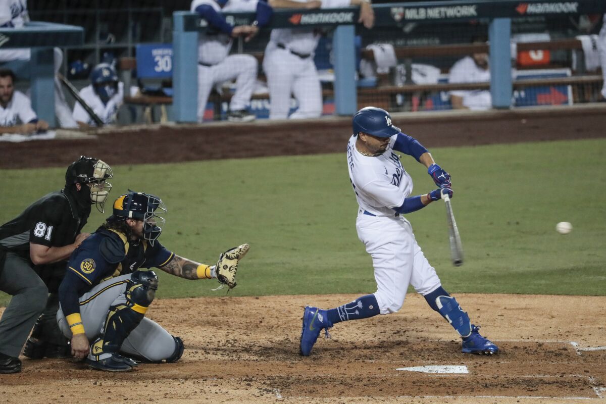Dodgers right fielder Mookie Betts connects on a two-run double in the fifth inning Thursday.