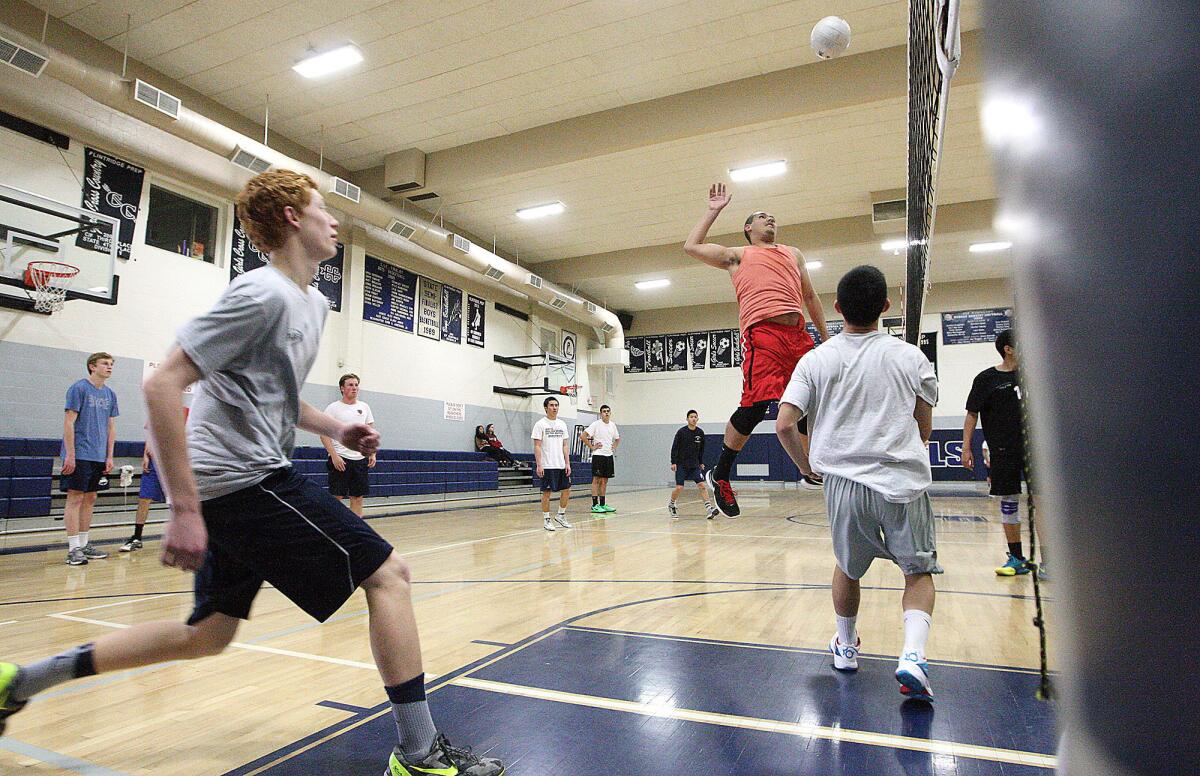 The Flintridge Prep boys' volleyball team works on setting and hitting during practice on Tuesday, February 25, 2014.
