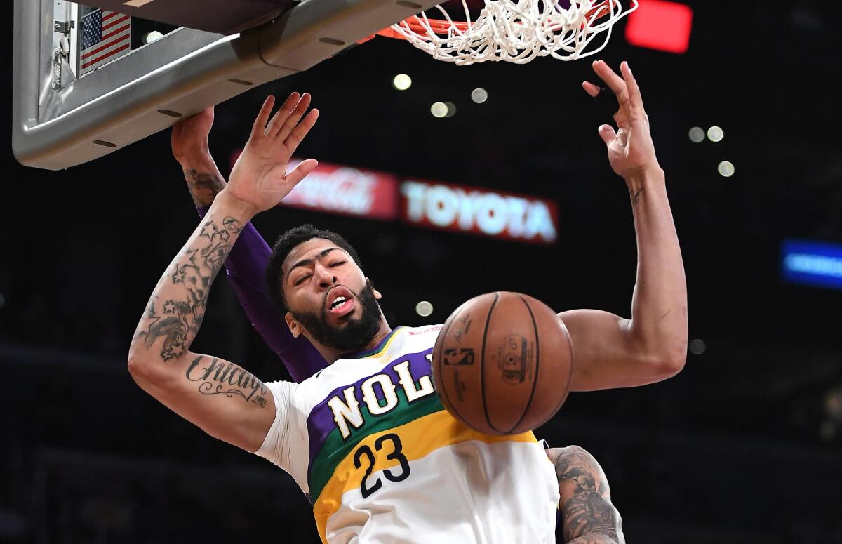 Pelicans forward Anthony Davis dunks against the Lakers during a game last season.