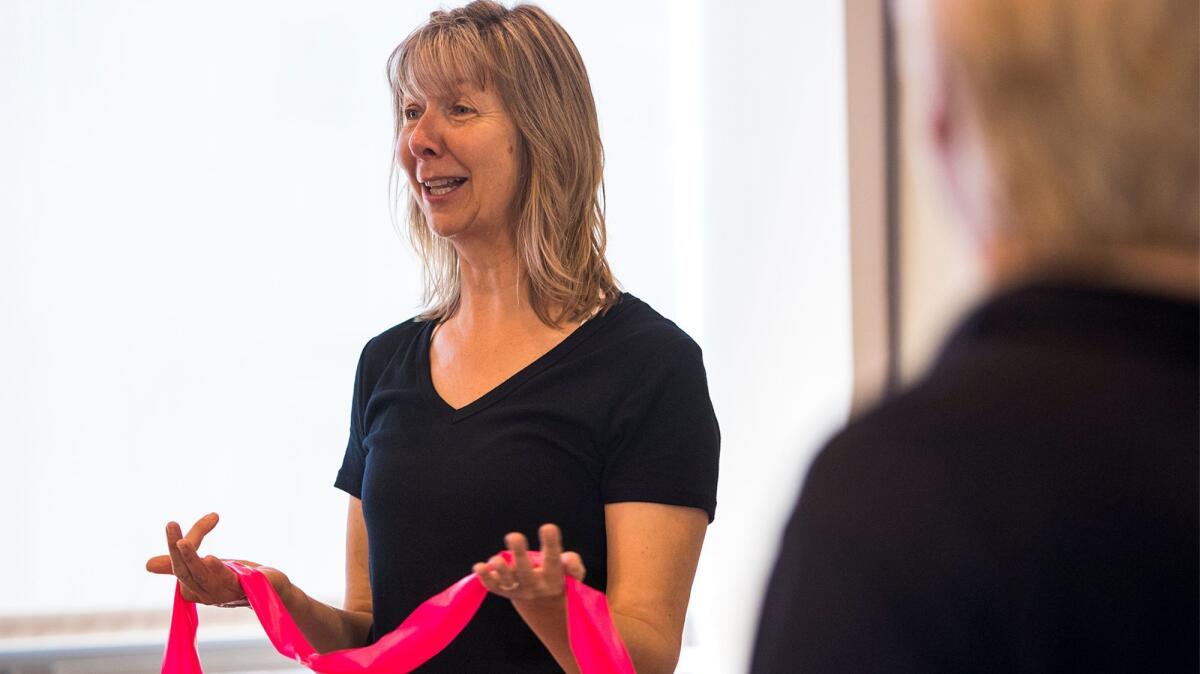 Kathryn Rollins of Costa Mesa teaches classes at the Oasis Senior Center in Corona del Mar designed to help senior citizens increase their bone density, remain limber and maintain a healthy lifestyle.