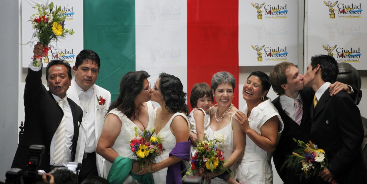 Same sex couples celebrate after getting married in Mexico City in March 2010.