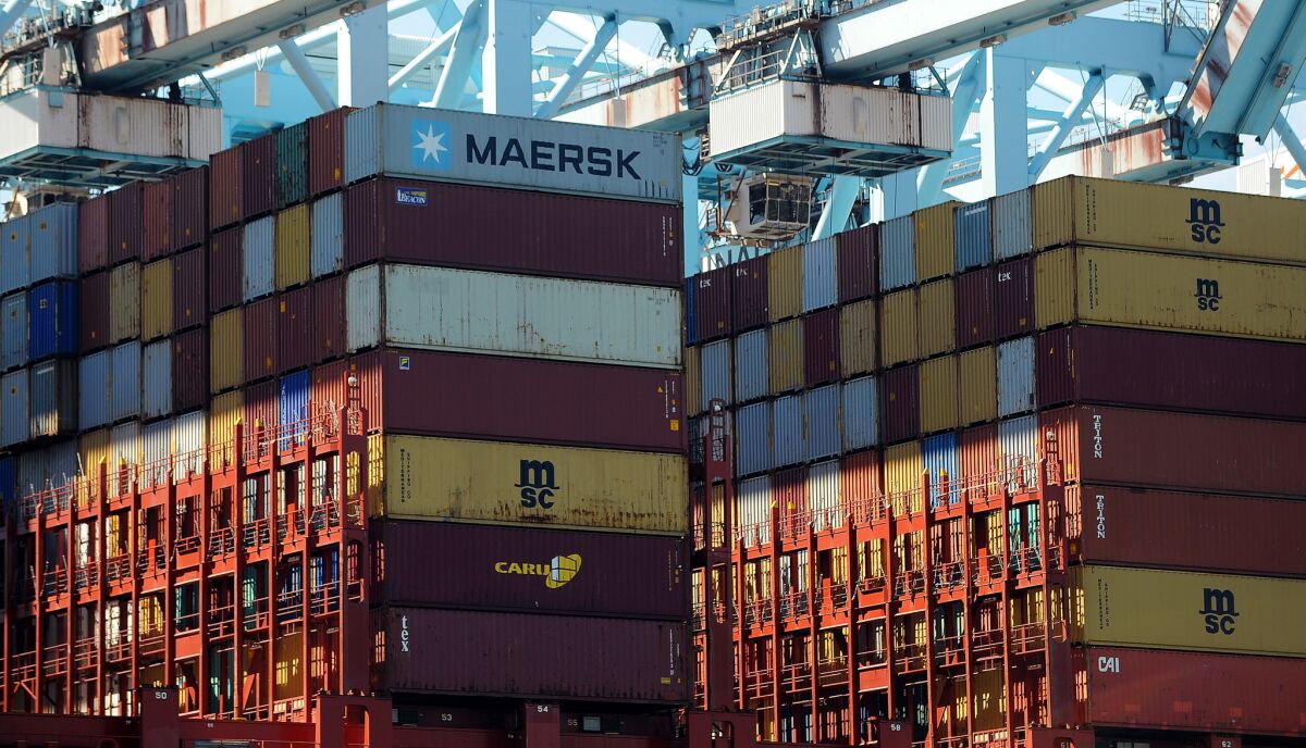 Stacks of containers are unloaded at the Port of Los Angeles last year.