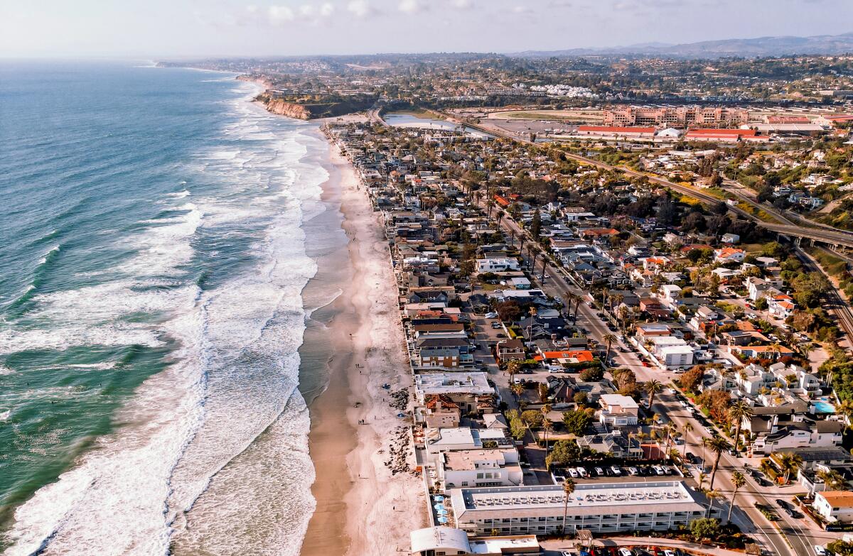 Aerial shot of the Del Mar coastline beach and houses.