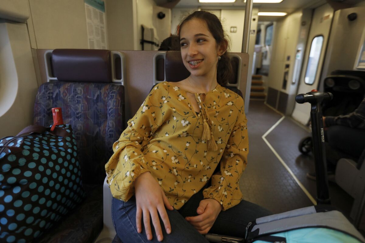 Mia Turel takes the train home after school in Los Angeles. (Francine Orr / Los Angeles Times)