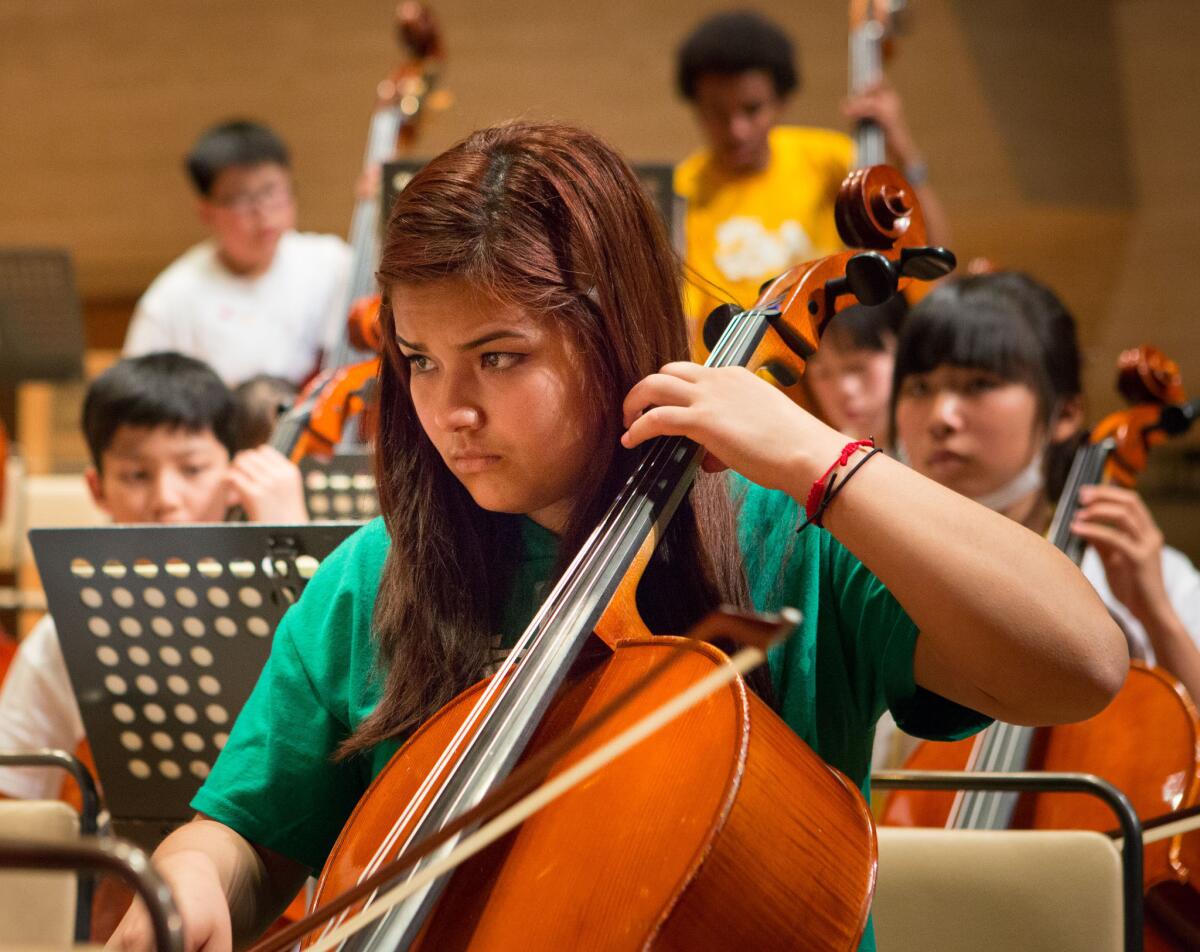 Cellist Karen Ramos Miranda, 16, in YOLA since 2009, with YOLA and El Systema Japan in Tokyo's Suntory Hall.
