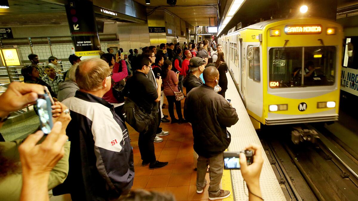 A crowd waits as the Expo Line to Santa Monica pulls in at 7th Street/Metro Center downtown in 2016.