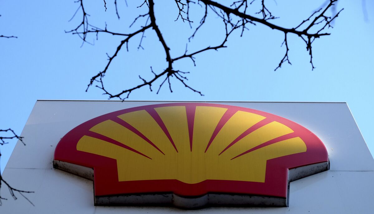 FILE - The Shell logo at a petrol station in London on Jan. 20, 2016. Royal Dutch Shell proposed moving its headquarters from the Netherlands to the United Kingdom and streamlining its structure in hopes of making it easier to move forward in a world transitioning away from a dependence on fossil fuels. (AP Photo/Kirsty Wigglesworth, File)