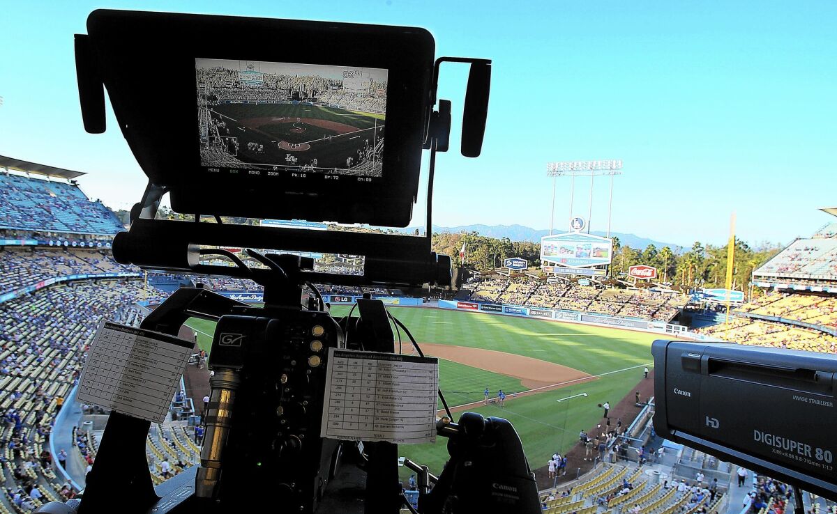 A TV camera is trained on the field at Dodger Stadium for the game between the Dodgers and Angels.
