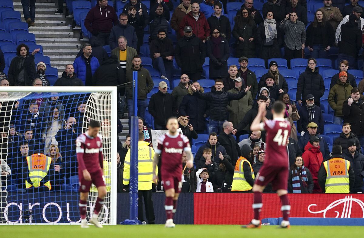West Ham's fans react as the players applaud them after the final whistle in the English Premier League soccer match between Brighton & Hove Albion and West Ham United at the American Express Community Stadium, Brighton, England, Saturday, March 4, 2023. (Zac Goodwin/PA via AP)