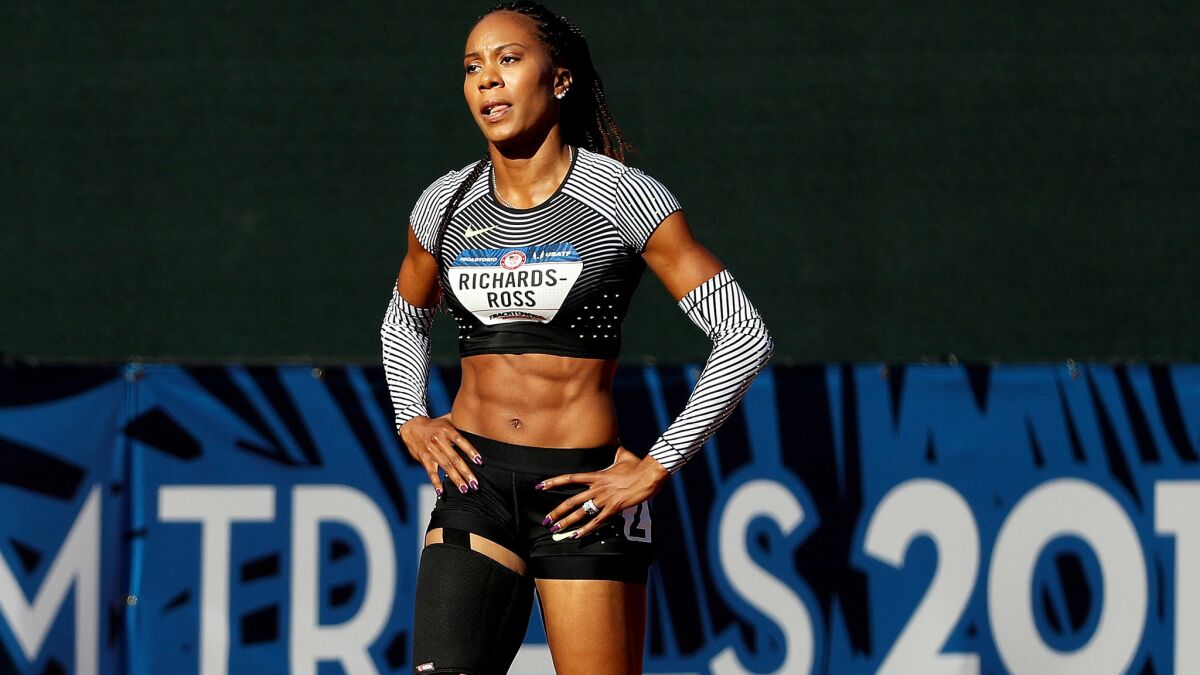 Sanya Richards-Ross walks off the track after failing to finish her heat in the 400 meters on Friday.
