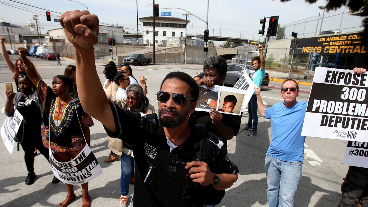 Protesters at an event organized by jail reform advocates block traffic outside the Twin Towers Jail in downtown Los Angeles on Mar. 10, 2017.