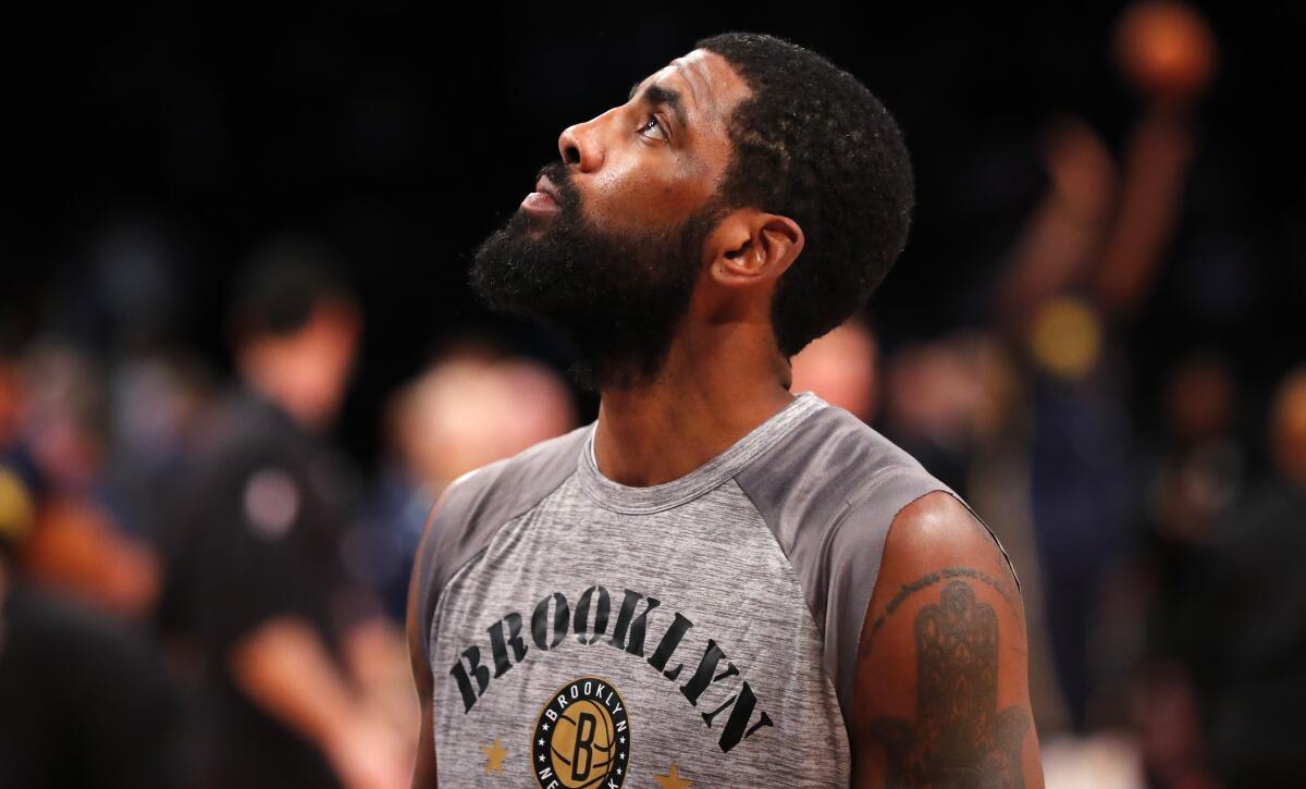 Brooklyn Nets guard Kyrie Irving looking up