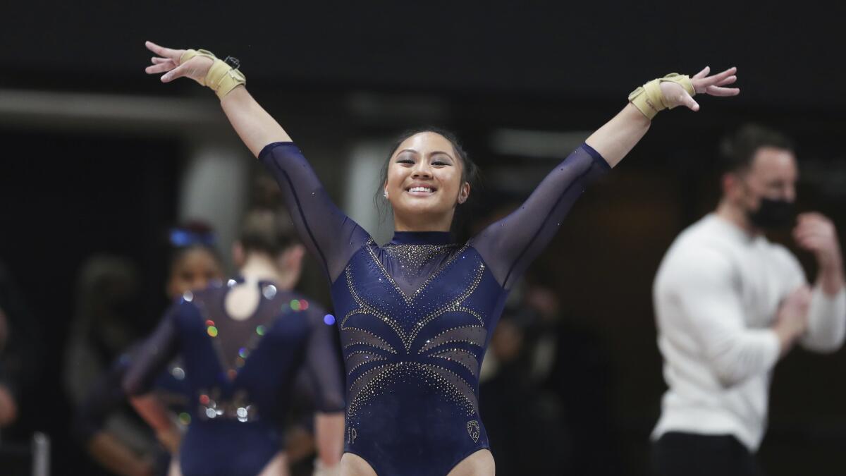 UCLA's Emma Malabuyo finishes a vault routine during a meet against UC Davis and Oregon State in January.
