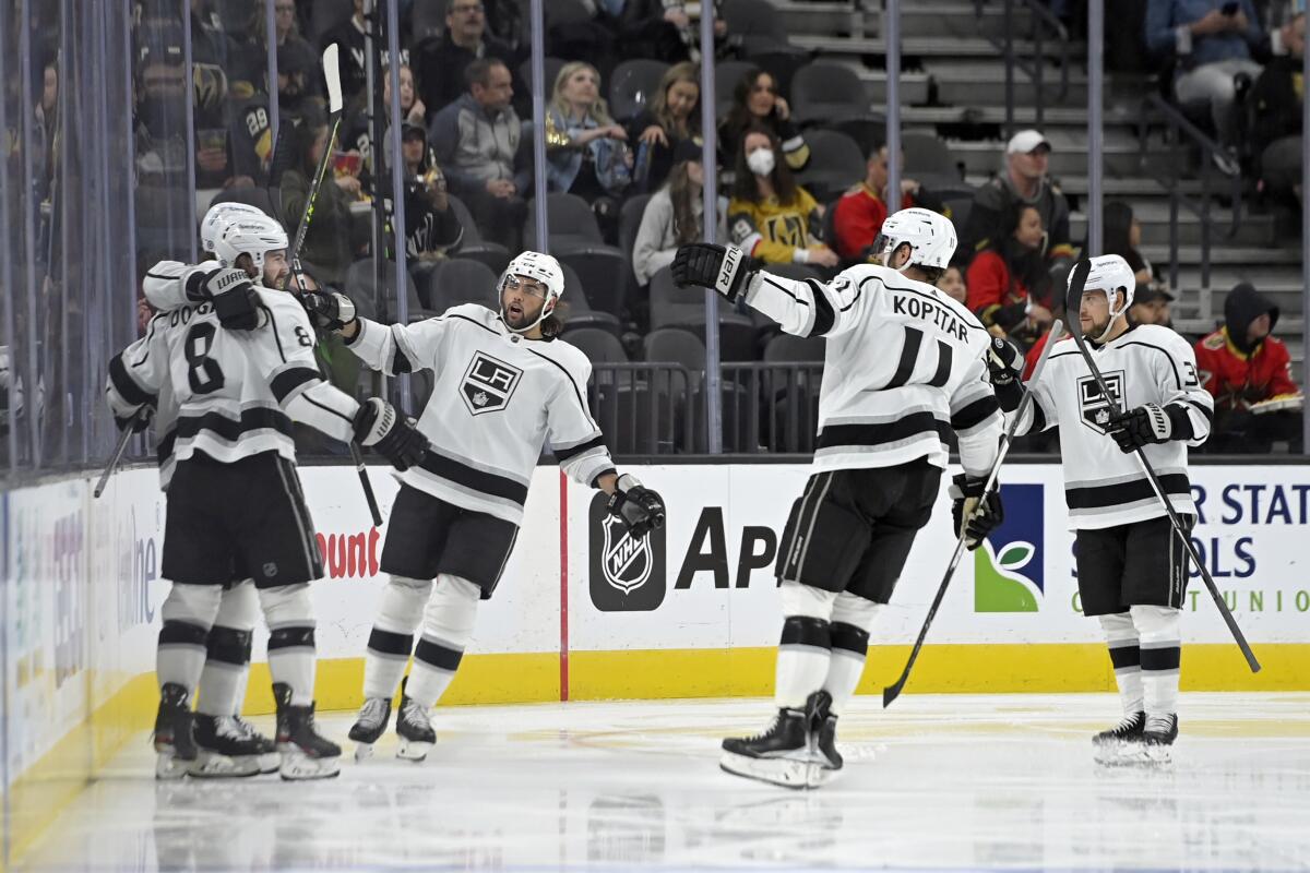 Los Angeles Kings defenseman Sean Durzi celebrates a goal with Los