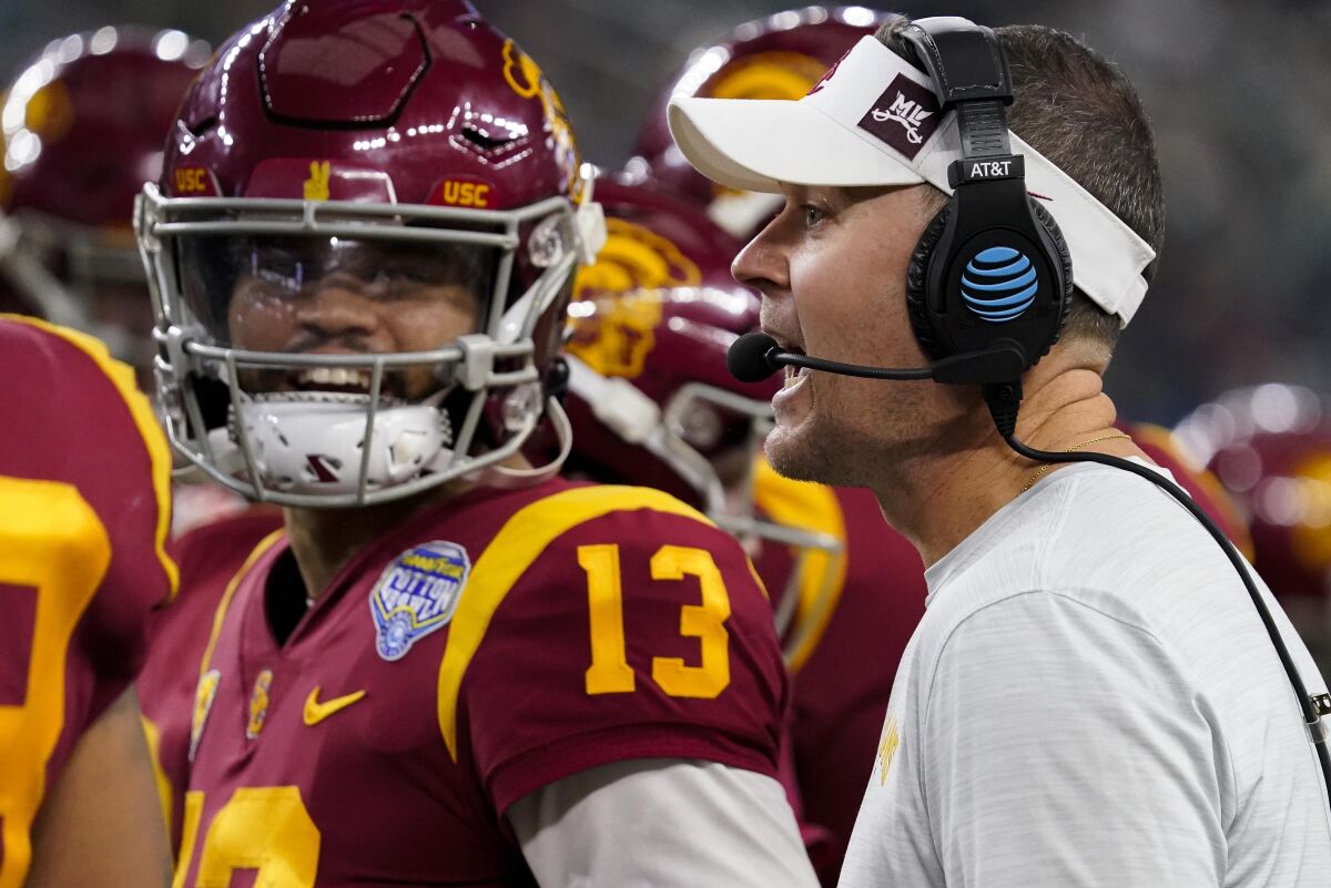 USC quarterback Caleb Williams talks to coach Lincoln Riley during the Cotton Bowl in January.
