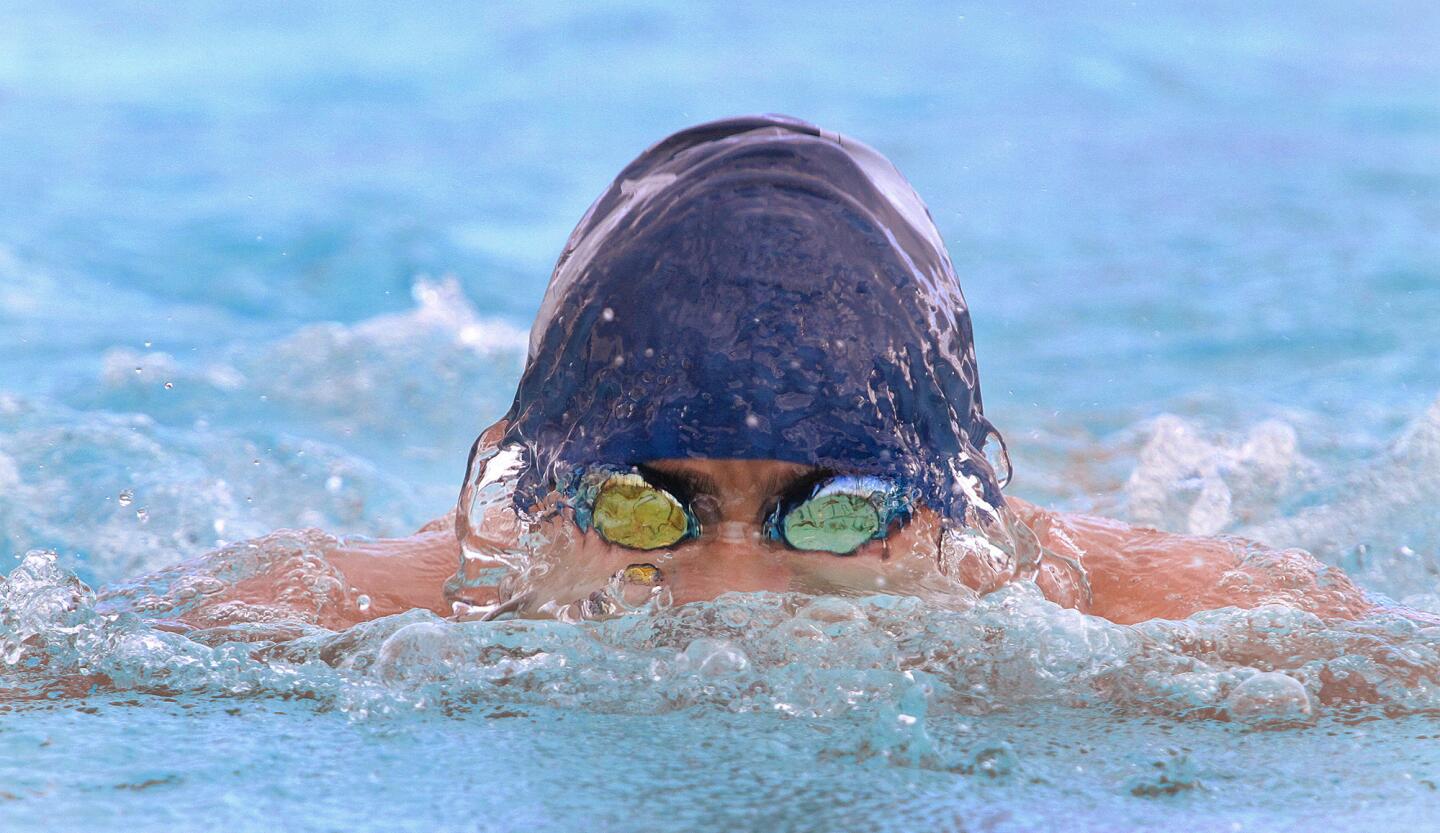Crescenta Valley's Daniel Park leads and wins the 100 meter breaststroke in a Pacific League swim meet between Crescenta Valley and Glendale at Glendale High School on Wednesday, March 26, 2014. (Tim Berger/Staff Photographer)