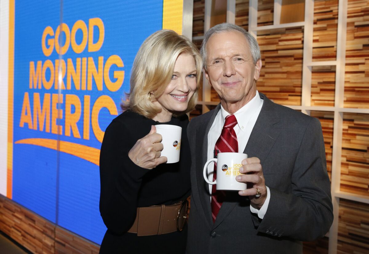 In this image released by ABC, Diane Sawyer, left, and Charles Gibson appear on "Good Morning America," for a special 40th anniversary celebration, Thursday, Nov. 19, 2015 in New York. (Heidi Gutman/ABC via AP)