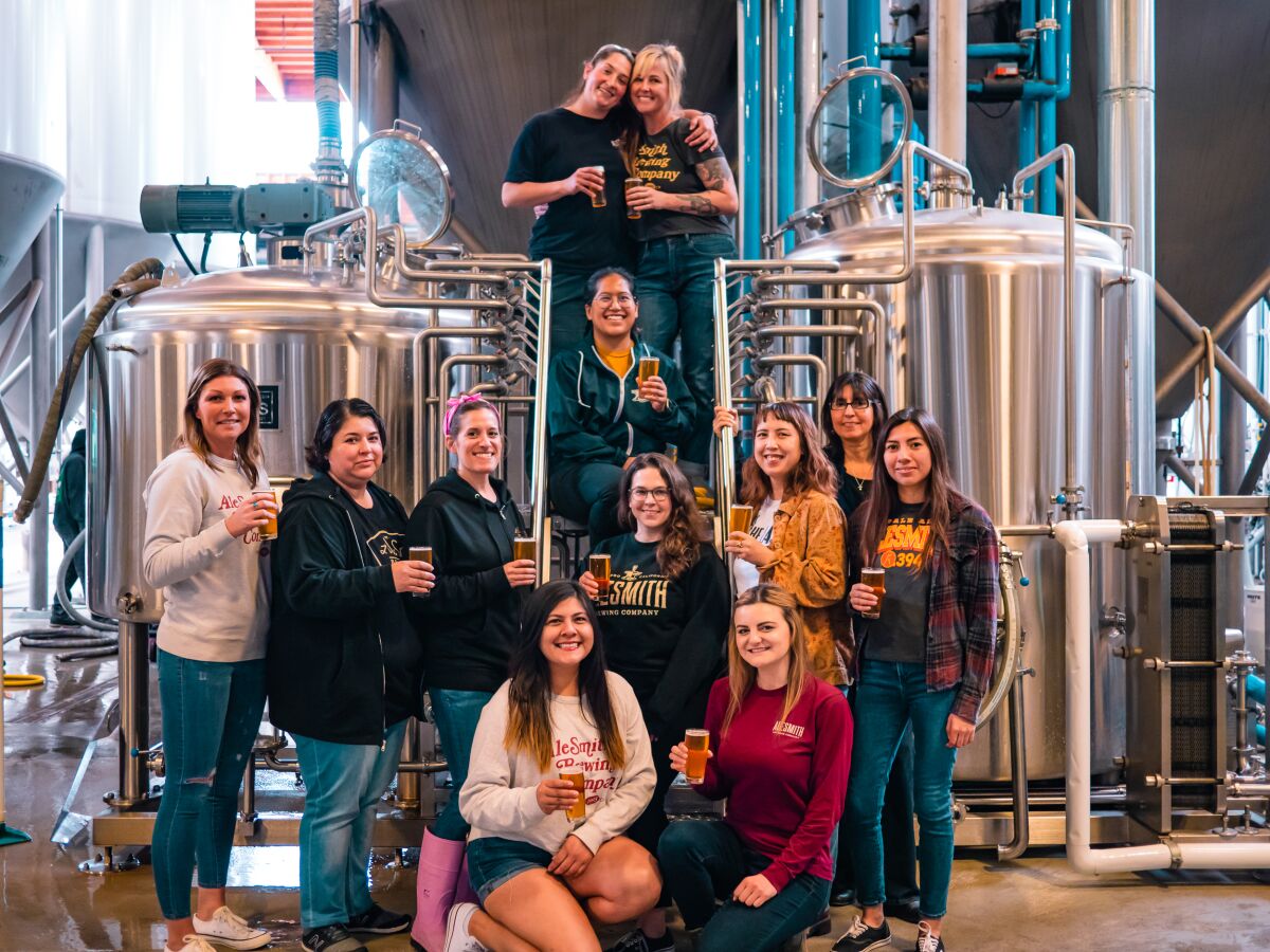 The AleSmith Brewing team behind the Fearless IPA take a group photo at Women's Brew Day.