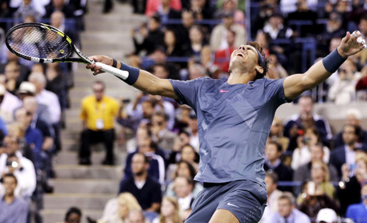 Rafael Nadal reacts after winning the final point in a four-set victory over Novak Djokovic in the men's championship match at the U.S. Open on Monday night.