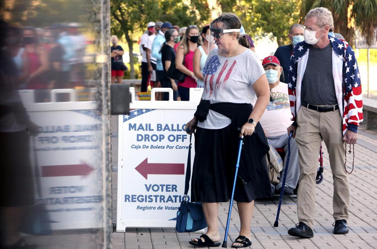 Voters wait in line to vote early in Clearwater, Fla., on Oct. 19.