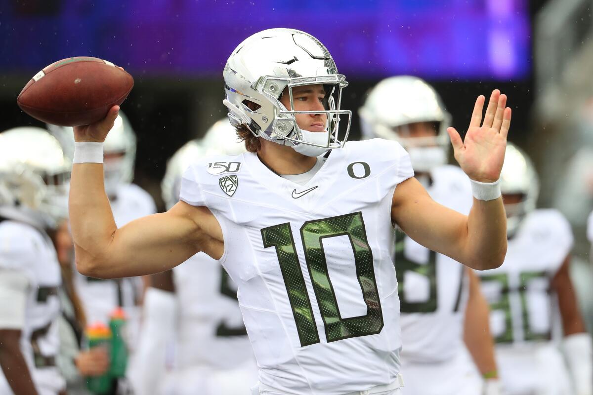 Oregon quarterback Justin Herbert warms up before facing Washington on Saturday in Seattle.