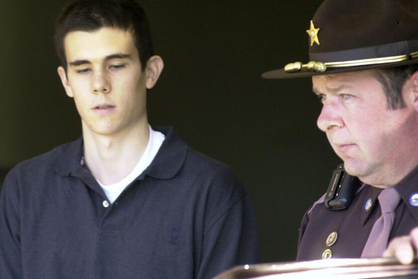 FILE - In this Dec. 7, 2001 file photo, James Parker is brought into court in Haverhill, N.H. where he faces charges in connection with the stabbing deaths of two Dartmouth College professors. Parker, who has served more than half of his life in prison for his role in the 2001 stabbing deaths of two married Dartmouth College professors as part of a plan to rob and kill people before fleeing overseas is getting his first chance at parole on Thursday, April 18, 2024. (AP Photo/Toby Talbot, File)