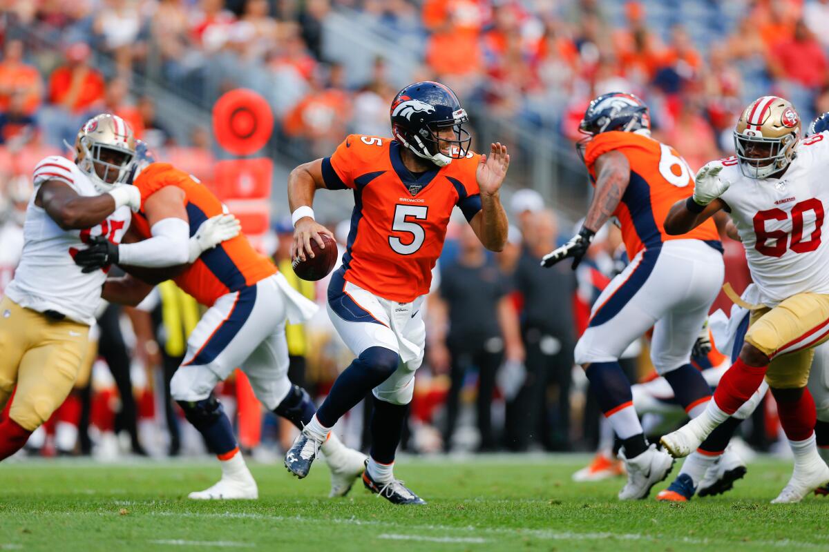 Denver Broncos quarterback Joe Flacco scrambles against the San Francisco 49ers.