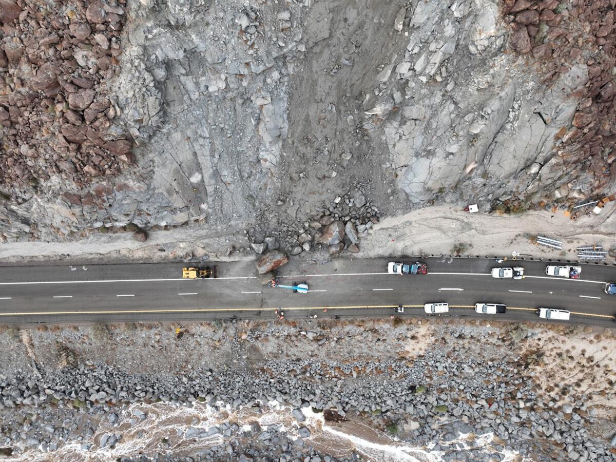 Caltrans crews work on Monday to clean up a rockslide that landed on the eastbound Interstate 8 near In-Ko-Pah on Sunday.