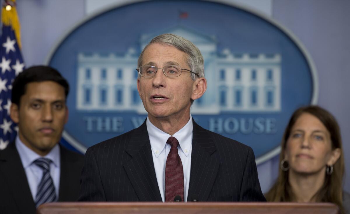 Dr. Anthony Fauci, with officials Raj Shah and Sylvia Burwell, speaks at the White House. 