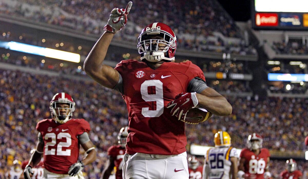 Alabama wide receiver Amari Cooper celebrates his 23-yard touchdown reception against LSU in the first half Saturday in Baton Rouge, La.