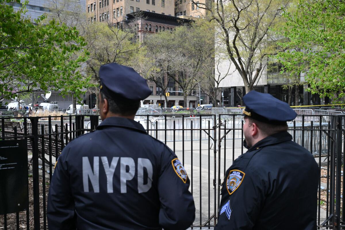 Police officers stand guard near Manhattan criminal court in New York City
