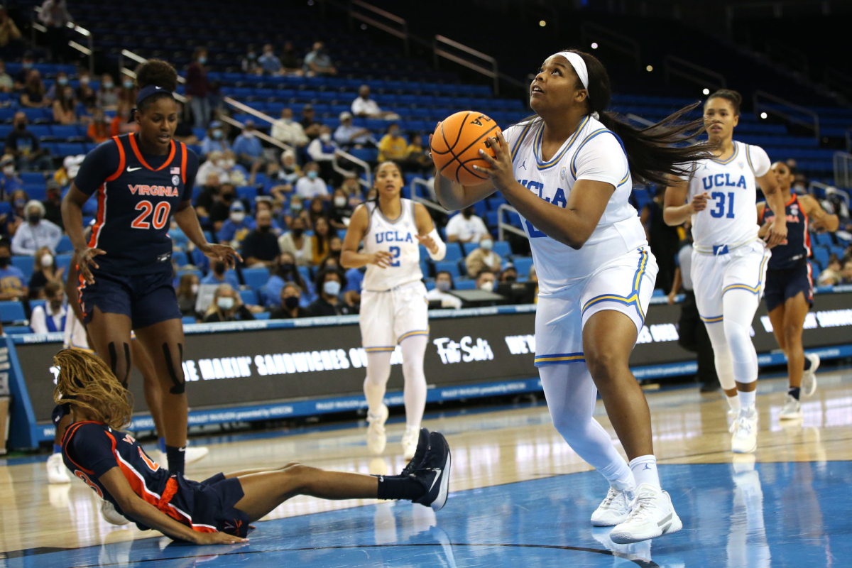 UCLA's IImar'I Thomas shoots against Virginia.