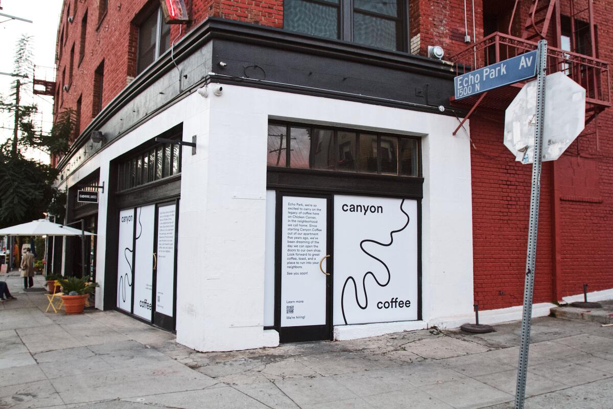 A red brick building with white Canyon Coffee signage.