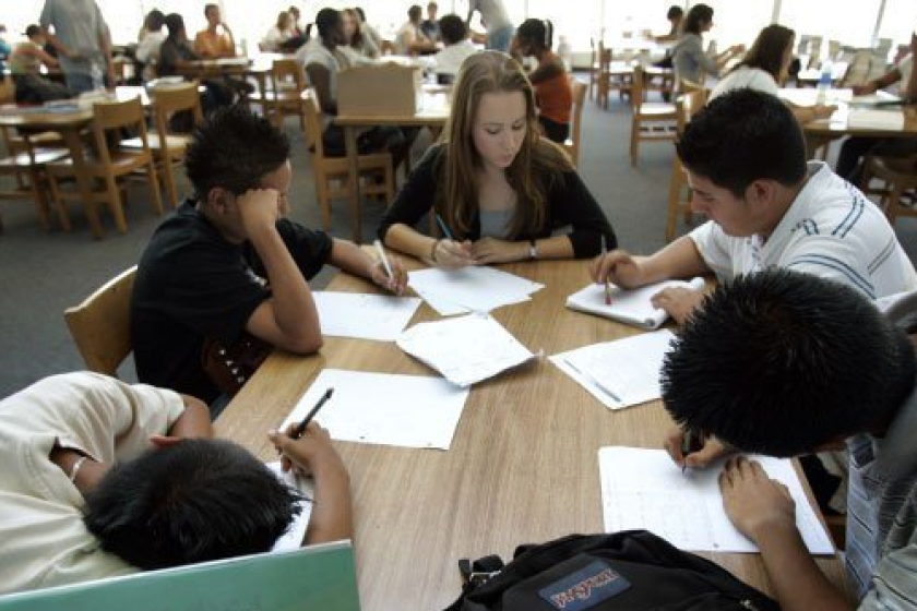 In a peer tutoring program at Scripps Ranch High School in 2016, Omar Morena (from left) and Gerardo Diaz talked about algebra with fellow students Lauren Trott, Enrique Calzado (top) and Ralph Agustin. San Diego Unified this year is launching a new math approach to increase access to advanced math courses.