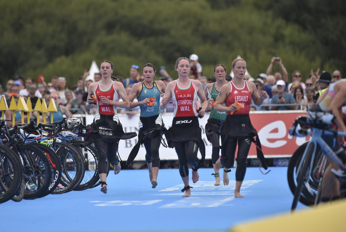 Athletes compete in the women's individual triathlon at the Commonwealth Games in Birmingham, England, Friday, July 29, 2022. (AP Photo/Rui Vieira)