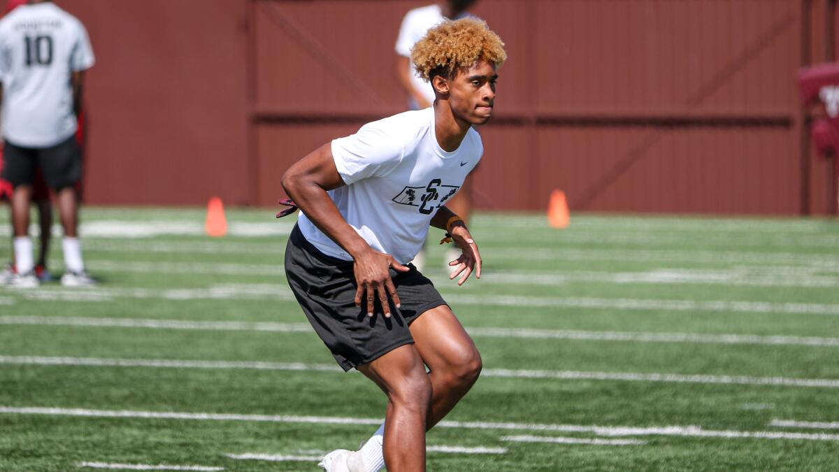 Pasadena Muir cornerback John Humphrey works on his backpedal during a drill at USC's elite camp on June 12.