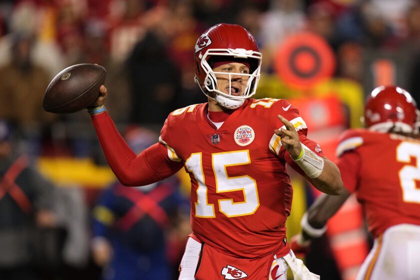 Kansas City Chiefs quarterback Patrick Mahomes (15) throws a pass during the second half of an NFL football game against the Los Angeles Rams Sunday, Nov. 27, 2022, in Kansas City, Mo. (AP Photo/Charlie Riedel)