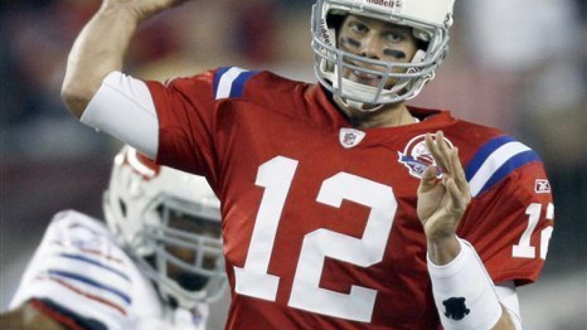 PATRIOTS STAR QUARTERBACK TOM BRADY IN THROWBACK UNIFORM 2