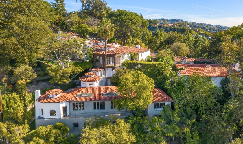 The 1920s estate includes a main house, two cottages, a bungalow and two-story guesthouse set among fountains and koi ponds.