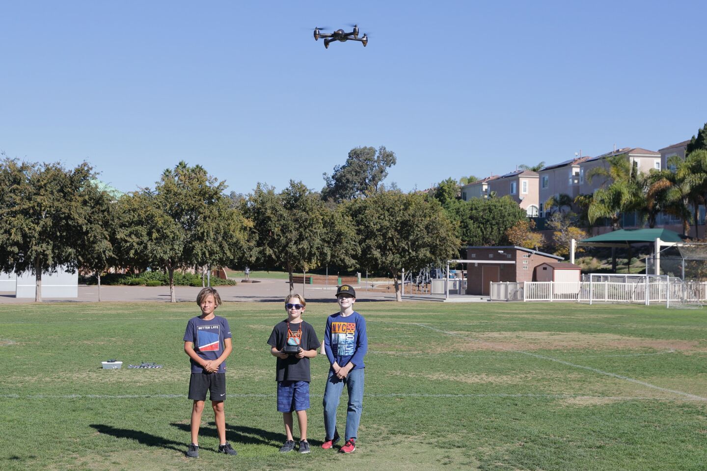 Jacob Chaves Kuss, Daniel Berionne, and Paxton Wiley-Szymanowski pilot a drone