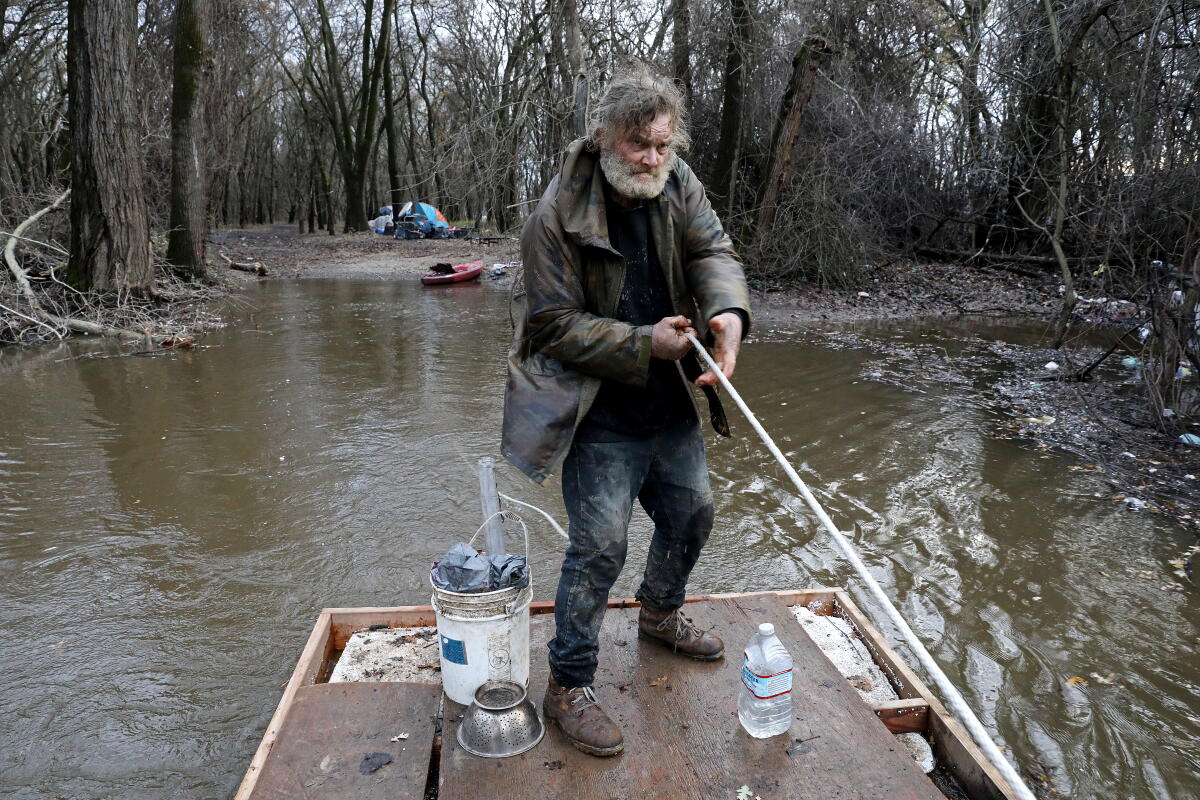 Homless Man On Raft California scrambles to protect homeless people from storm - Los ...
