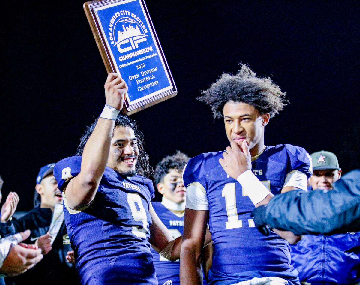 Seniors Maynor Morales, left, and Peyton Waters celebrate winning three consecutive City titles for Birmingham High.